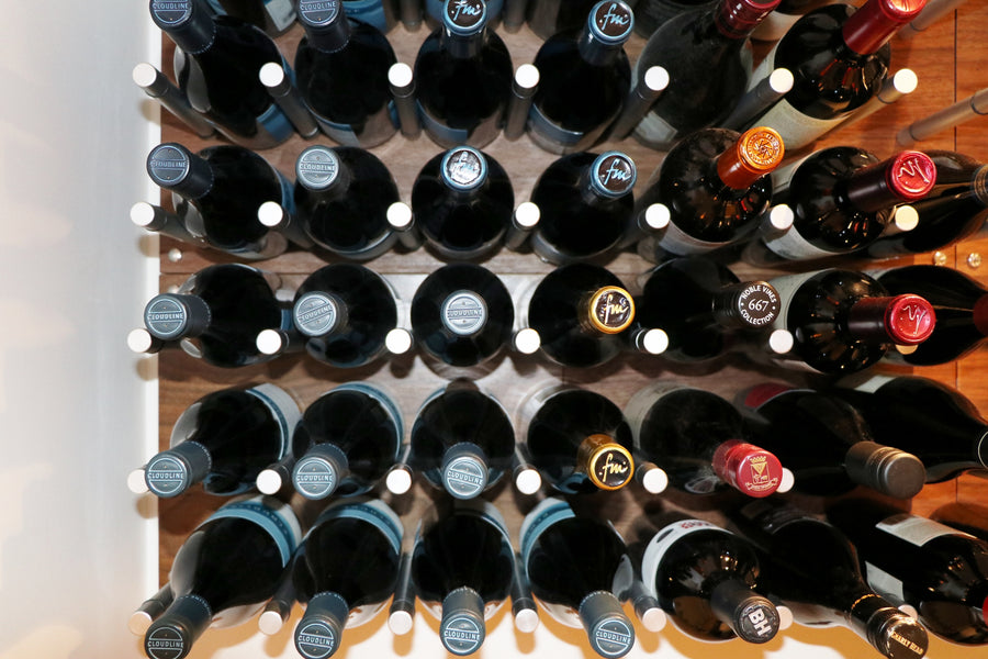 Cork forward wine display with wine pegs